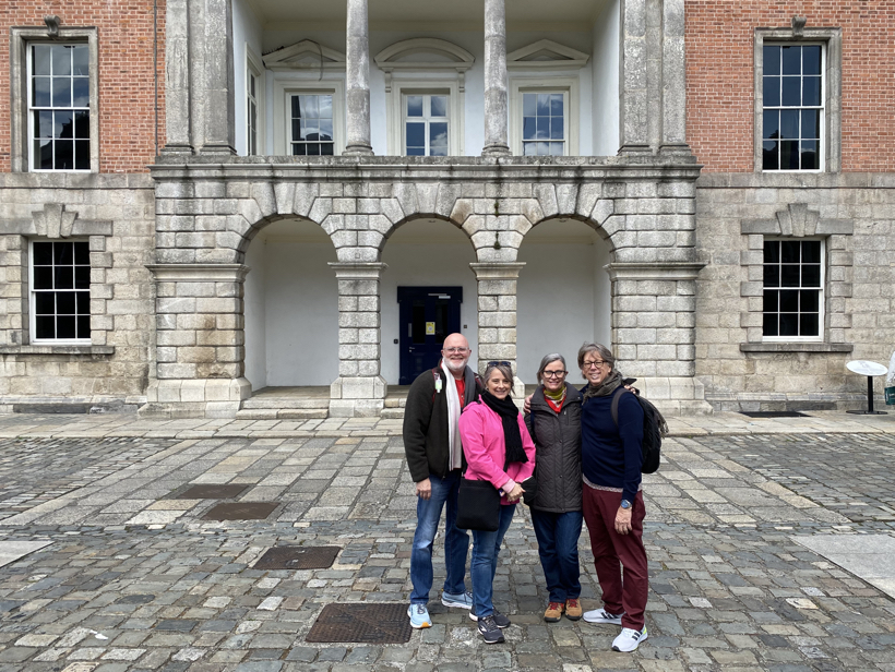 Georgia and Mike Sanders standing with others in front of a building in Ireland