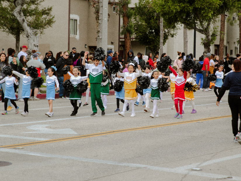 A group of children cressed as cheerleaders at the Black History Parade